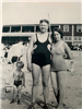 Black and white photo of couple and child on the beach