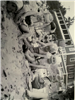 Black and white photo of kids playing together on the beach