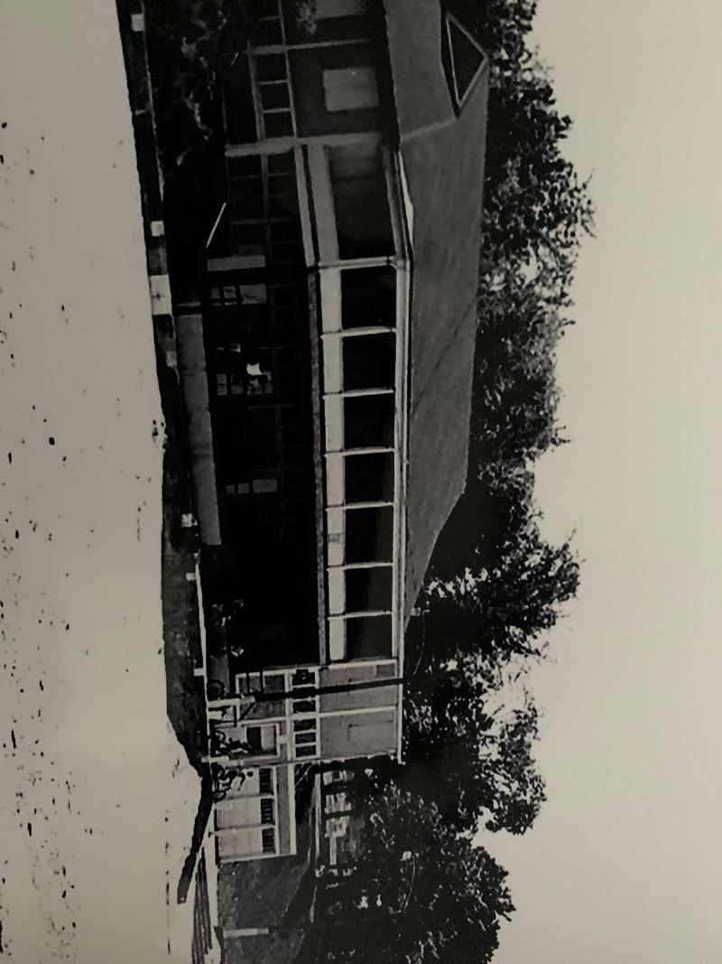 Black and white photo of improved bath house at the beach